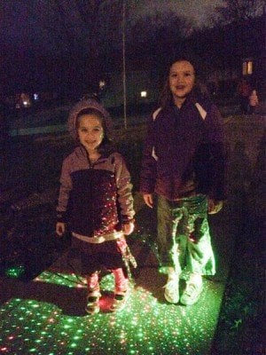 I've sure most are aware of "lazy lights": the new laser Christmas lights. The girls posed for a picture for me.